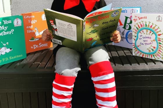 Child reading Dr Seuss books